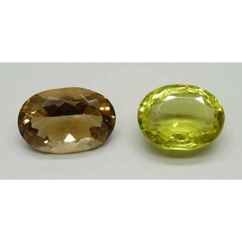 973 - Two large gemstones, smoky quartz, 16.9g, and lemon quartz, 17.5g