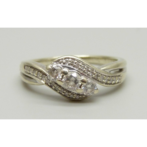 979 - A 9ct white gold and diamond ring, 0.50ct diamond weight marked on the shank, 4g, S