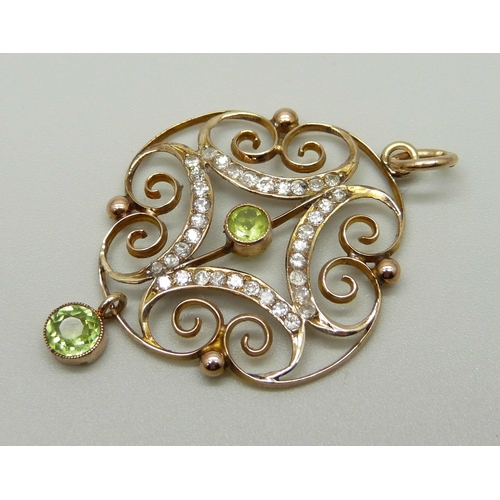 987 - An Edwardian 9ct gold, peridot and diamond pendant, 2.9g, 29mm wide, (tests as 9ct gold)