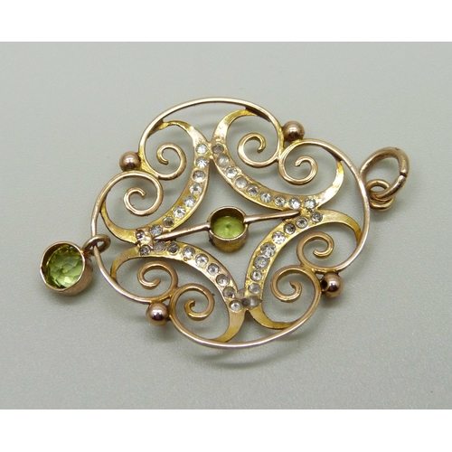 987 - An Edwardian 9ct gold, peridot and diamond pendant, 2.9g, 29mm wide, (tests as 9ct gold)