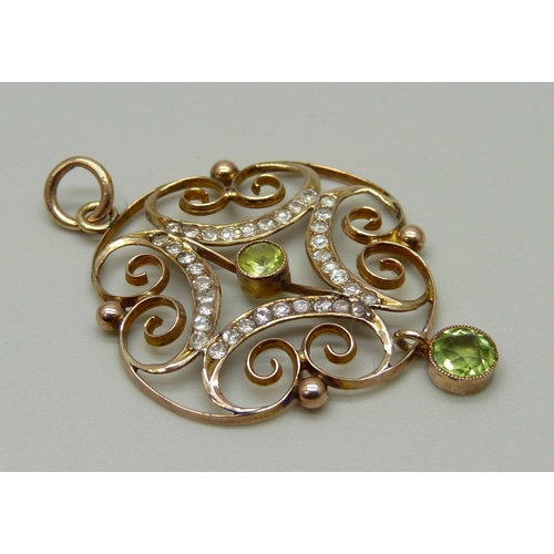 987 - An Edwardian 9ct gold, peridot and diamond pendant, 2.9g, 29mm wide, (tests as 9ct gold)