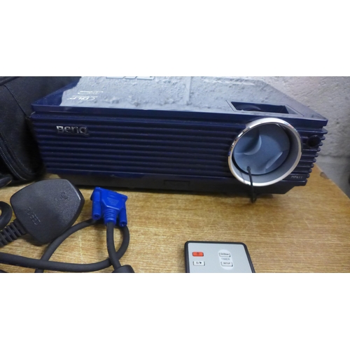 2110 - A BenQ MP611 projector in soft carry case with leads and remote control