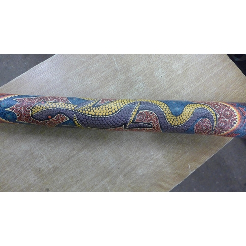 2116 - A wooden didgeridoo with decorative Aboriginal design