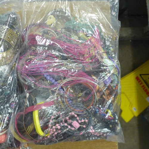 2118 - Three bags containing a large quantity of costume jewellery approx. 4kg per bag