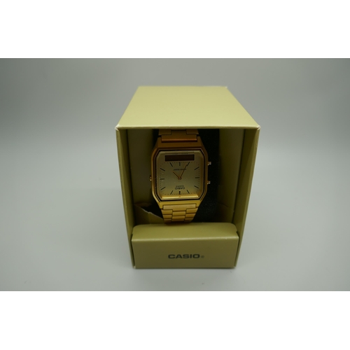 2145 - A men's Casio digital display black resin strap watch and a men's Casio yellow metal stainless steel... 