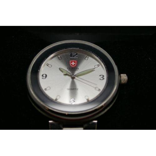 2155 - A Geneva round face stainless steel quartz wristwatch in presentation box