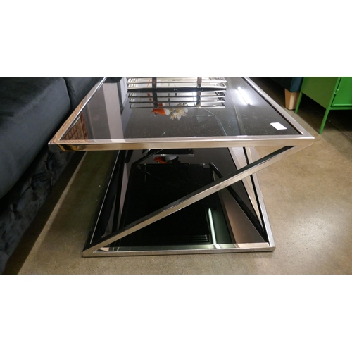 1321 - A chrome and black glass coffee table and lamp table * this lot is subject to VAT