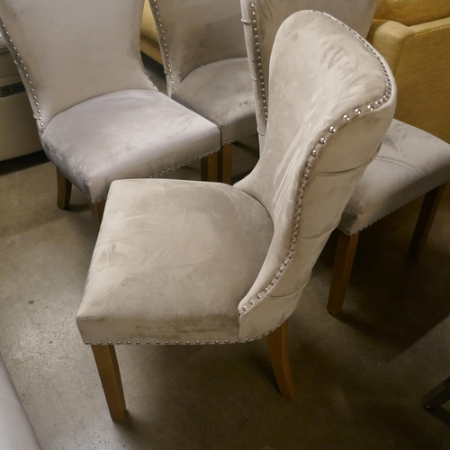 1359 - A set of four taupe velvet buttoned dining chairs