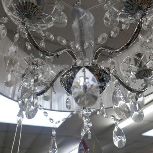 1440 - A chrome five armed chandelier with white shade