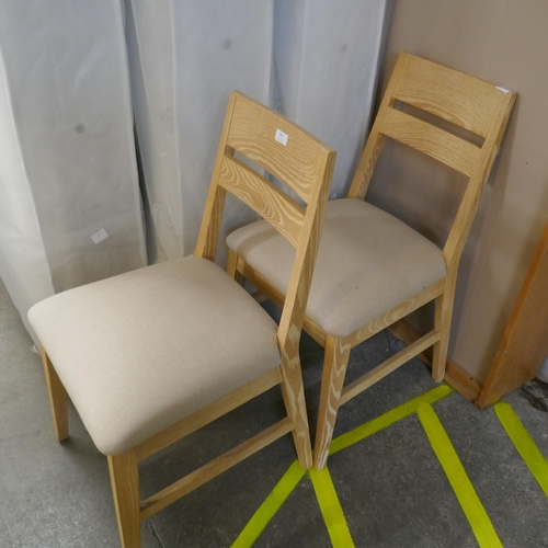 1497 - A pair of light wood side chairs