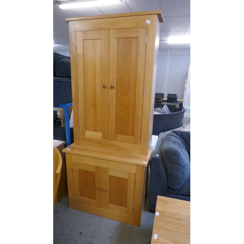 1532 - A tall oak four door cabinet