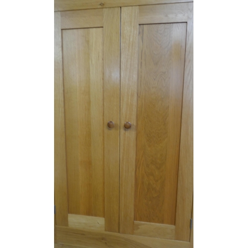 1532 - A tall oak four door cabinet