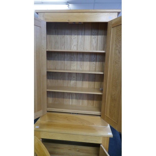 1532 - A tall oak four door cabinet