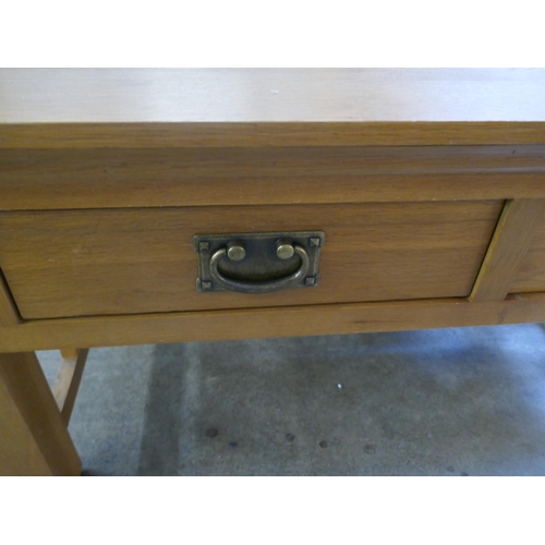 1545 - An Oak two drawer coffee table