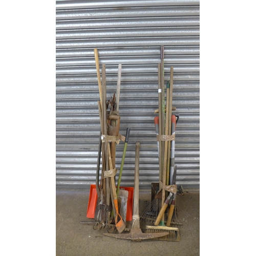 2277 - 2 Bundles of garden tools including shovels, clippers, tillers, a brush, a rake, a pick axe, saws, e... 