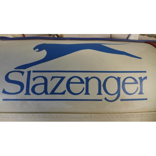 2307 - A Slazenger leather golf bag with 8 golf clubs including Bronty chip master, and fazer etc