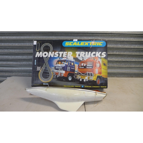 2360 - A vintage model sailing boat and a Scalextric Monster Trucks slot racing game