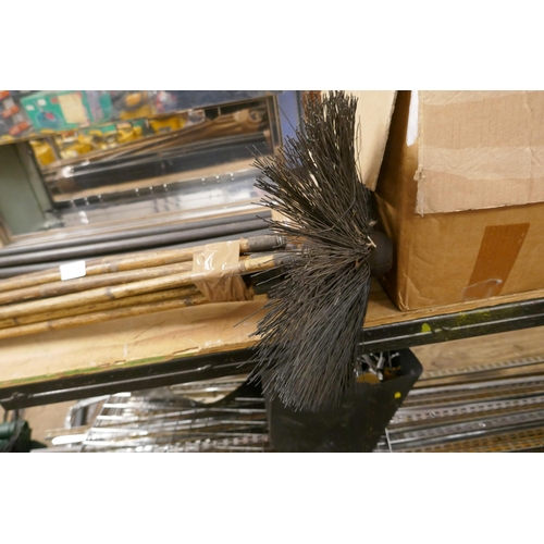 2464 - A bundle of drain rods and a bundle of chimney sweeping rods