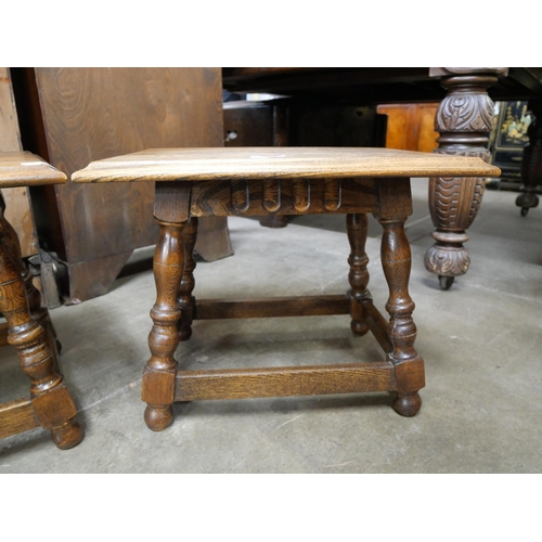 105 - A pair of 18th Century style oak lamp tables