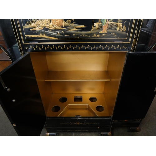 108 - An Art Deco black Japanned cocktail cabinet