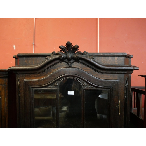 114 - A 19th Century style French carved oak single door bookcase