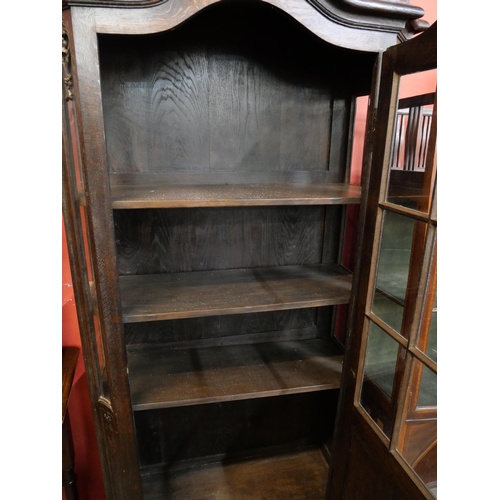 114 - A 19th Century style French carved oak single door bookcase