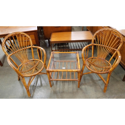 23 - A pair of Italian bamboo chairs and a coffee table