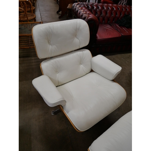 3 - A Charles & Ray Eames style simulated rosewood and white leather revolving lounge chair and ottoman