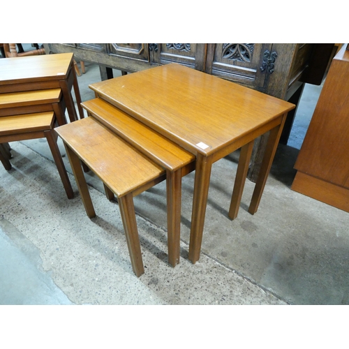 51 - Two teak nests of tables