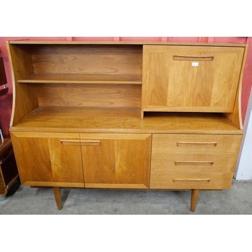 6 - A teak highboard