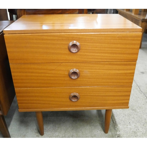 77 - A small teak chest of drawers