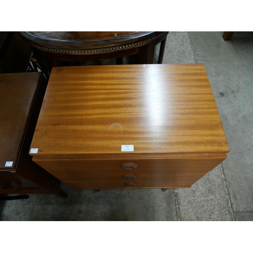 77 - A small teak chest of drawers