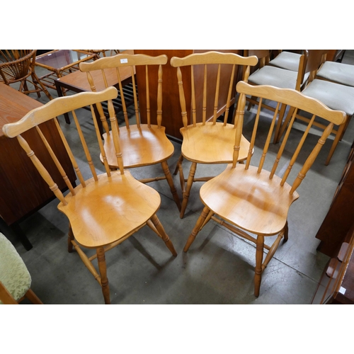 80 - A set of four beech spindle back kitchen chairs