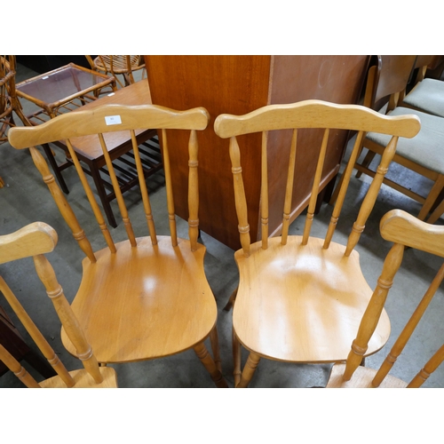 80 - A set of four beech spindle back kitchen chairs