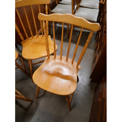 80 - A set of four beech spindle back kitchen chairs