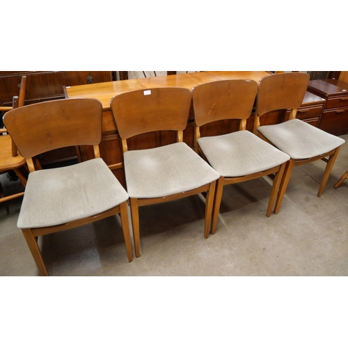 81 - A set of four teak dining chairs