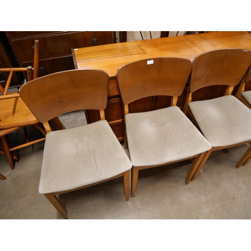 81 - A set of four teak dining chairs