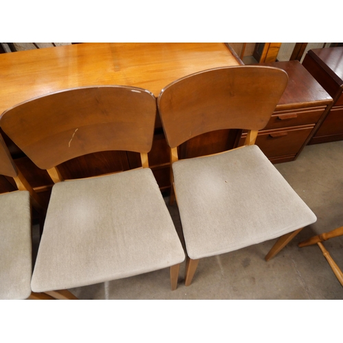 81 - A set of four teak dining chairs