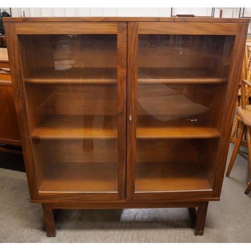 82 - A teak two door bookcase