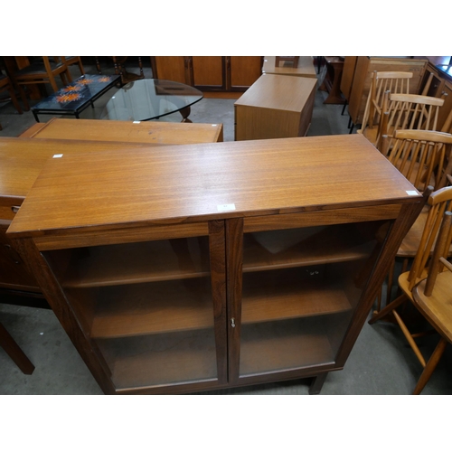 82 - A teak two door bookcase