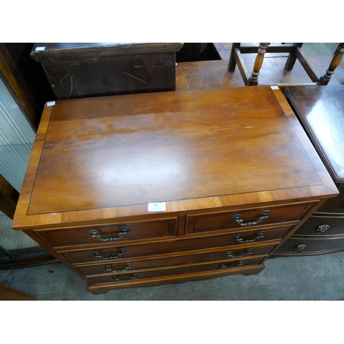 95 - A George III style yew wood chest of drawers