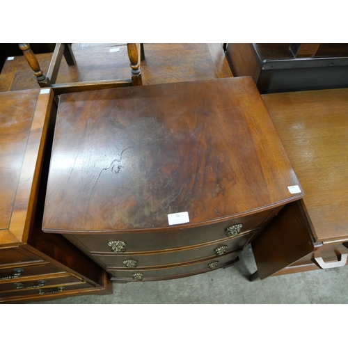 96 - A small George III style mahogany bow front chest of drawers