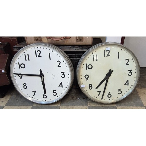 379 - A pair of vintage industrial factory clocks