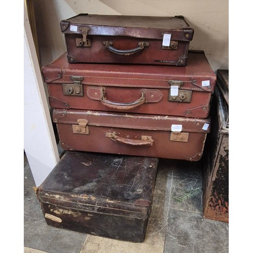 381 - Four vintage leather suitcases