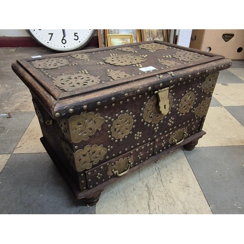 382 - A Zanzibar hardwood and brass mounted chest