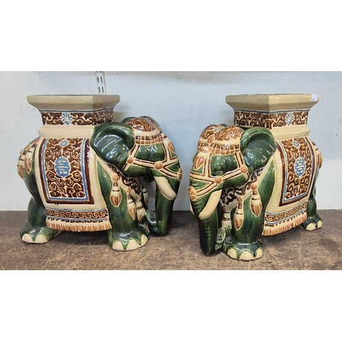 384 - A pair of Oriental elephant shaped porcelain garden seats