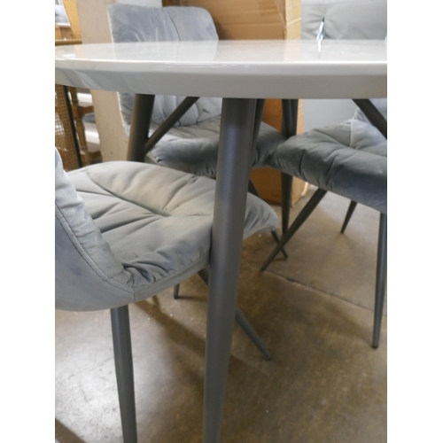 1341 - A Logan circular dining table and four grey velvet chairs