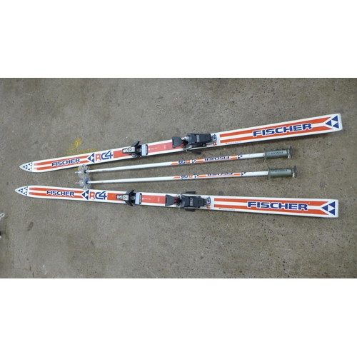 2235 - A pair of Fischer Salomon S637 skis and a pair of Fischer RC4 skiing poles in a carry bag