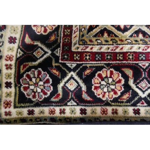 1400 - A deep multi coloured ground Cashan runner, diamond medallion design