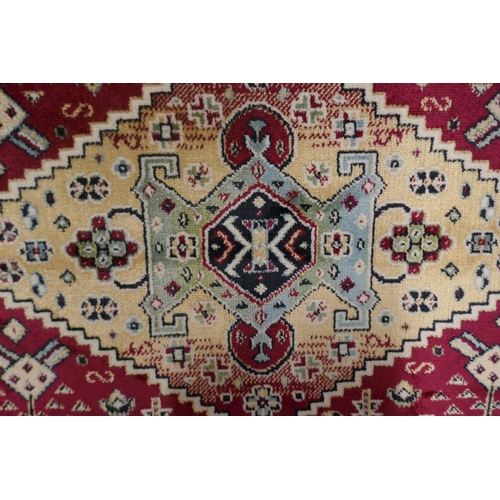 1400 - A deep multi coloured ground Cashan runner, diamond medallion design